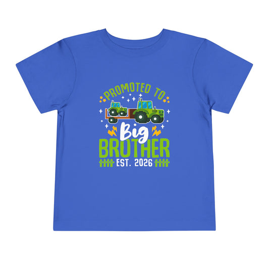 Blue t-shirt with 'Promoted to Big Brother Est. 2026' text and tractor graphic on a white background
