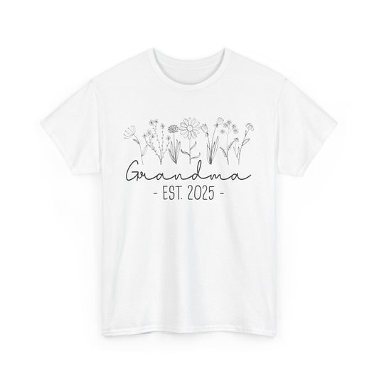 white ‘Promoted to Grandma 2025’ T‑shirt styled with flowers, ideal pregnancy reveal gift flat presentation