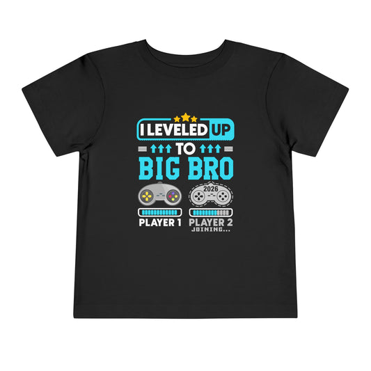 Leveled Up to Big Bro est 2026 T-shirt Black t-shirt with gaming-themed text and graphics on a white background