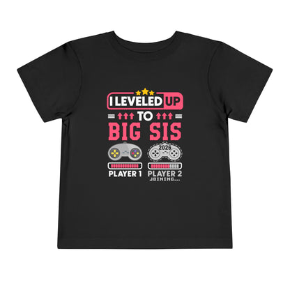 I Leveled Up to Big Sister 2026 T-Shirt Black t-shirt with gaming-themed text and graphics on a white background