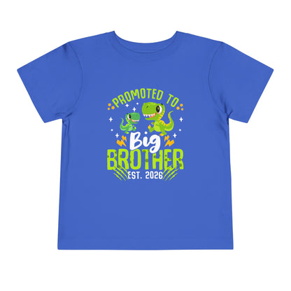 Blue t-shirt with dinosaur graphics and text 'Promoted to Big Brother Est. 2026' on a white background