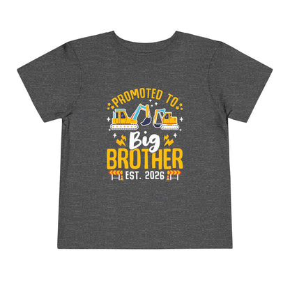 Gray t-shirt with 'Promoted to Big Brother Est. 2026' text and construction vehicle graphics on a white background