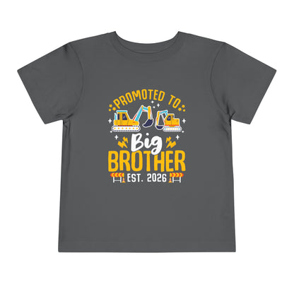 Gray t-shirt with 'Promoted to Big Brother Est. 2026' text and construction vehicle graphics on a white background