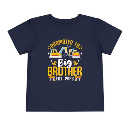 Navy blue t-shirt with 'Promoted to Big Brother Est. 2026' text and construction vehicle graphics on a white background.