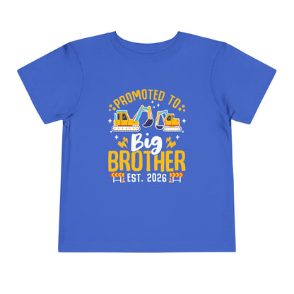 Blue t-shirt with 'Promoted to Big Brother Est. 2026' text and construction vehicle graphics on a white background