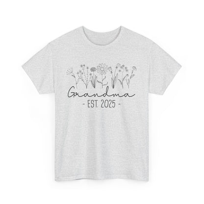 ‘Promoted to Grandma 2025’ T‑shirt styled with flowers, ideal pregnancy reveal gift flat presentation