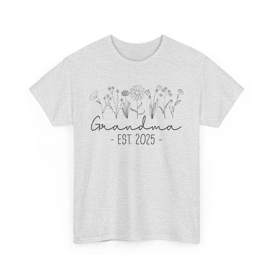 ‘Promoted to Grandma 2025’ T‑shirt styled with flowers, ideal pregnancy reveal gift flat presentation