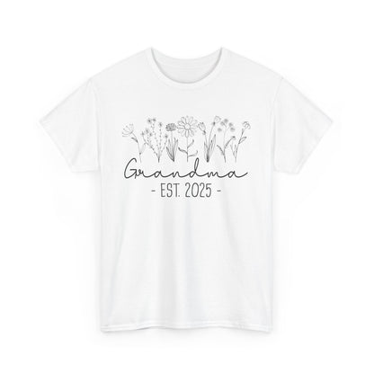white ‘Promoted to Grandma 2025’ T‑shirt styled with flowers, ideal pregnancy reveal gift flat presentation